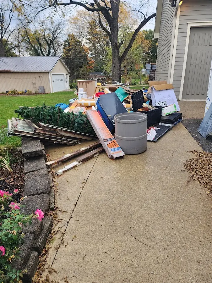 Dumpster being loaded with debris for Commercial Dumpster Rental in Albany